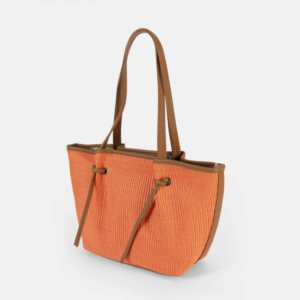 Pepe Moll Orange tote bag with brown handles on a white background