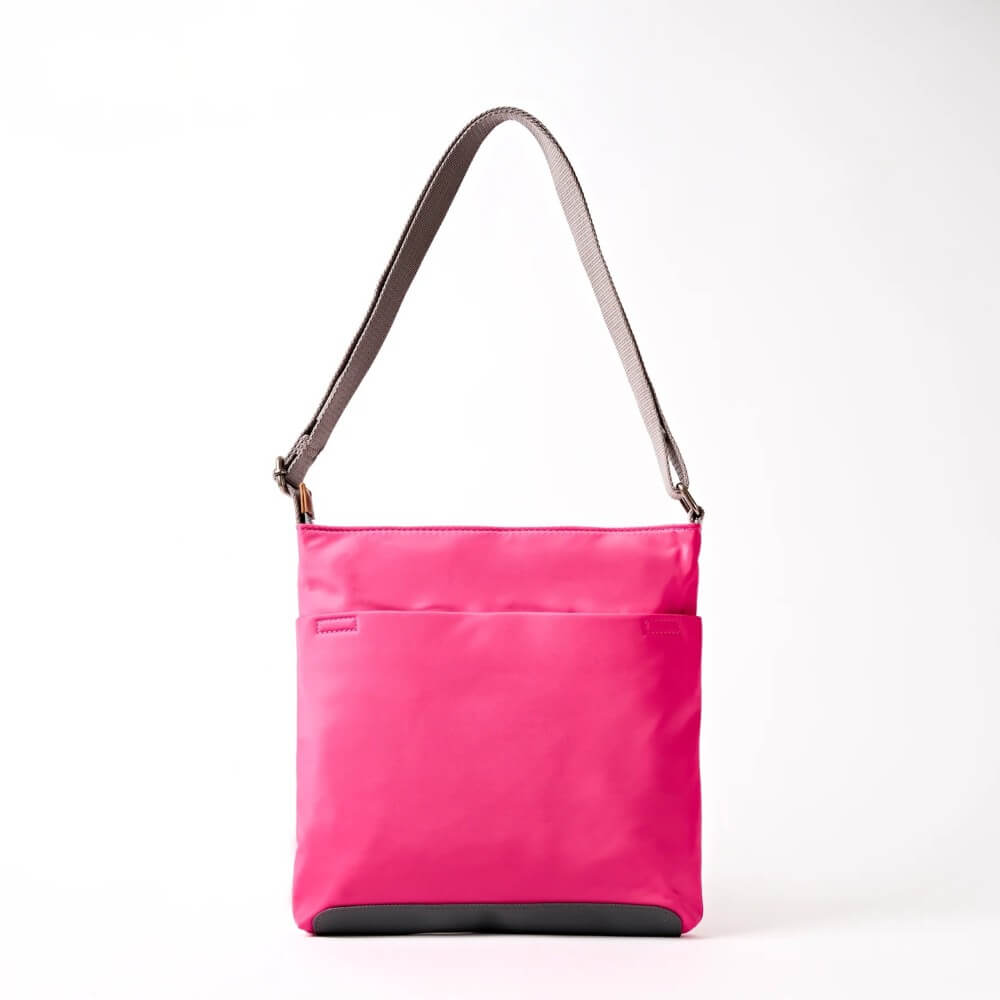 Roka Pink shoulder bag with a strap on a white background