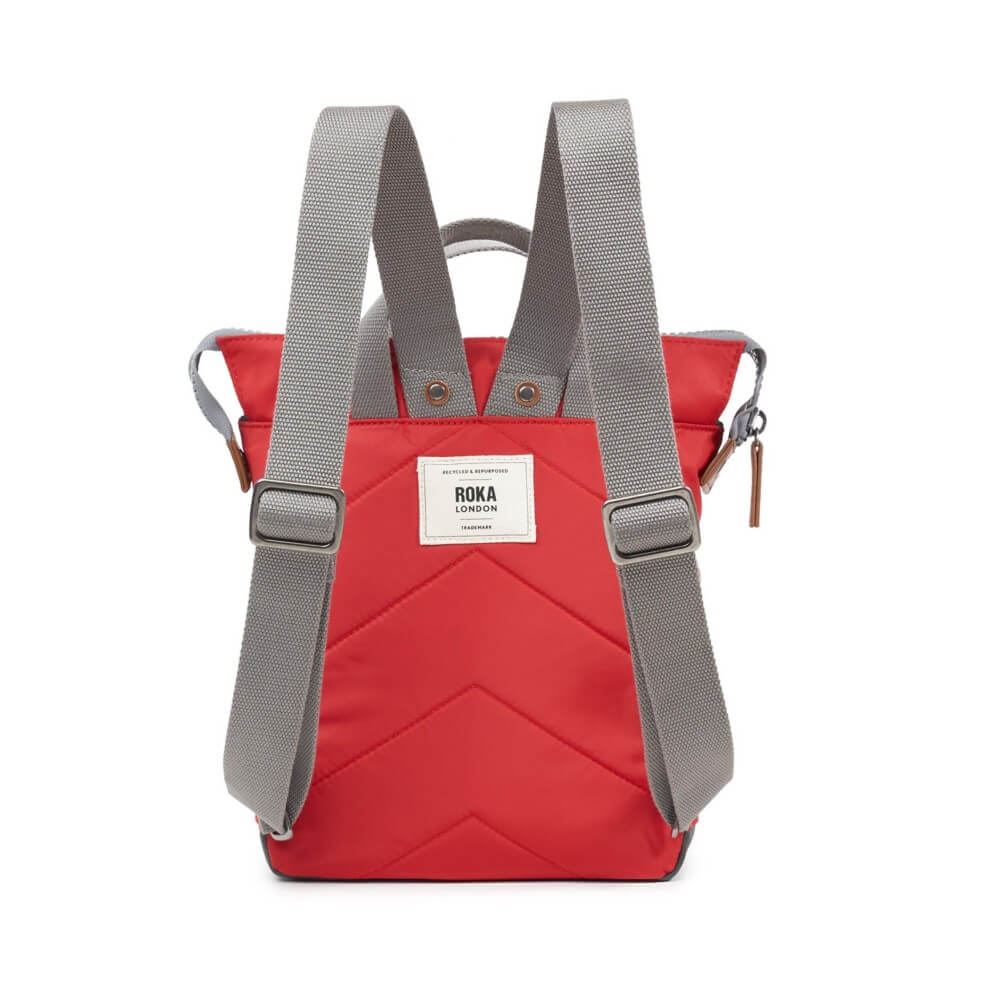 Red backpack with gray straps on a white background