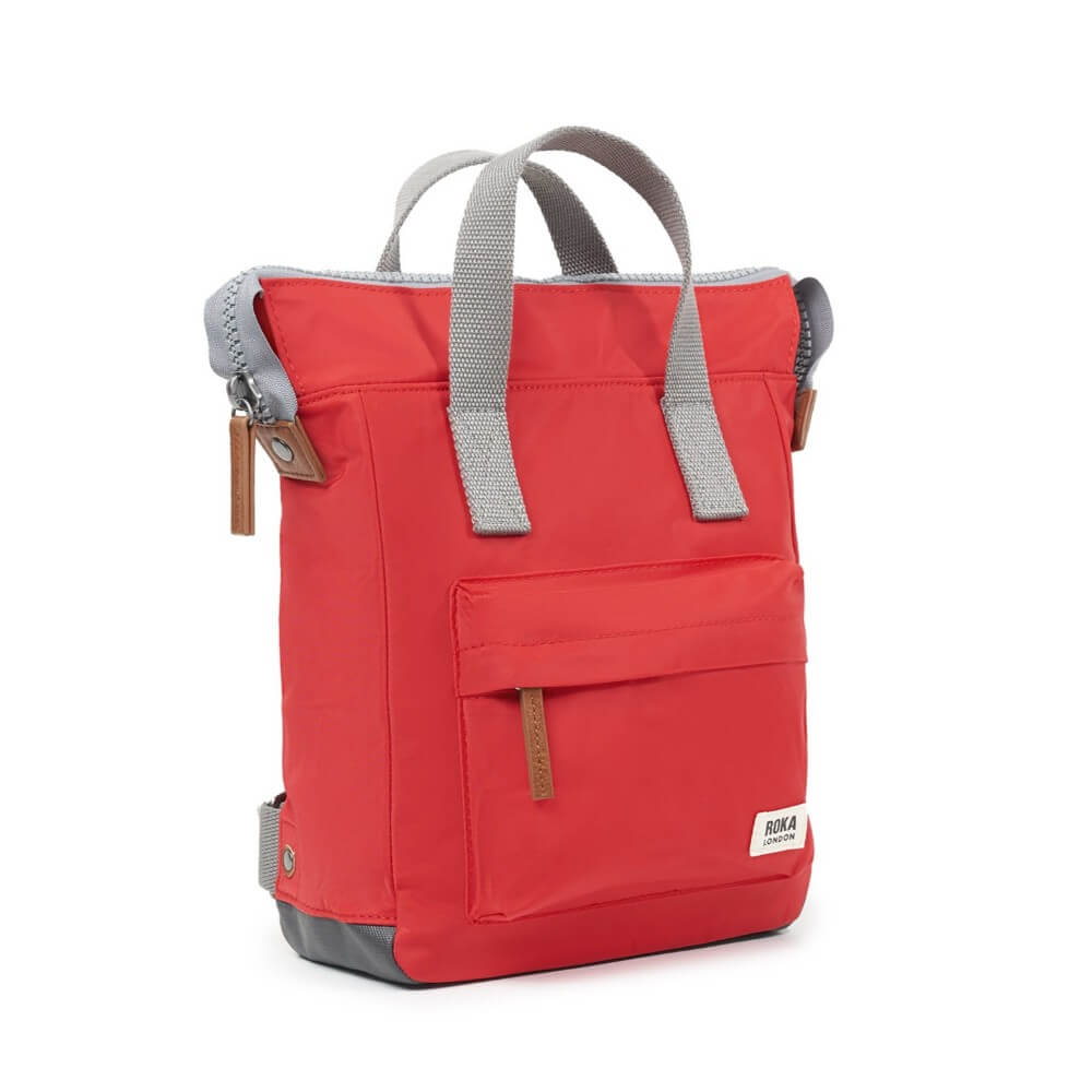 Red backpack with gray straps on a white background