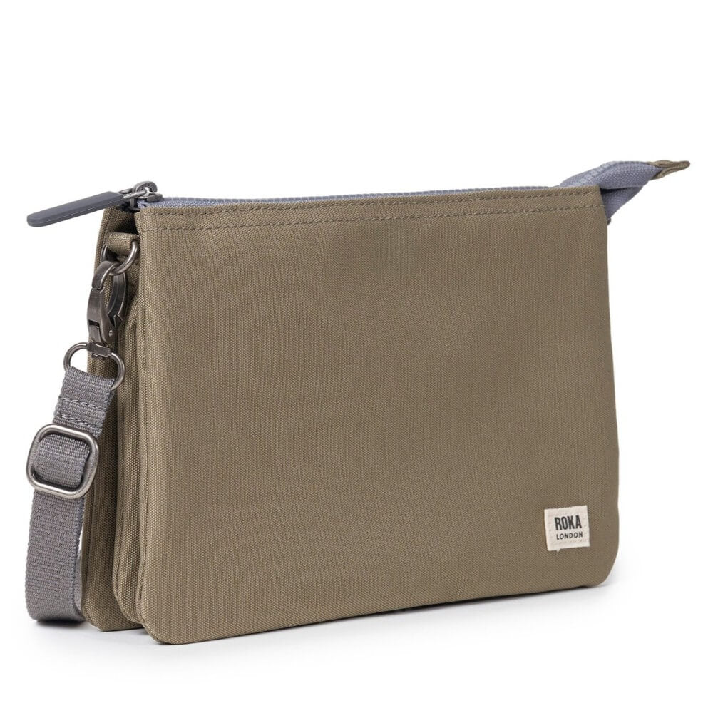 Brown shoulder bag with a strap on a white background