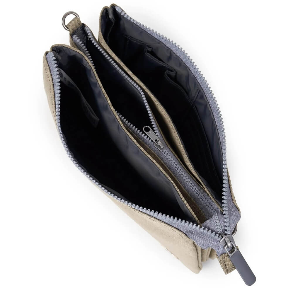 Open beige pouch with gray zipper on a white background