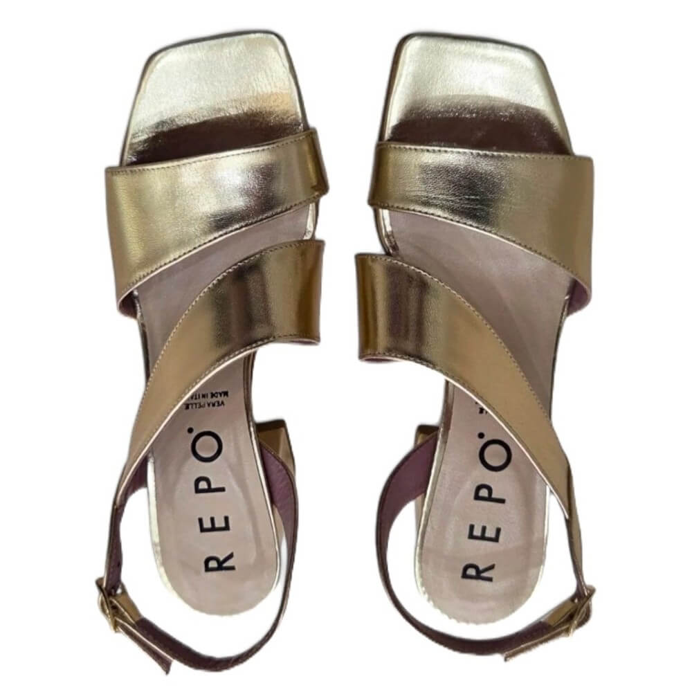 Gold sandals with 'REPO' branding on a white background