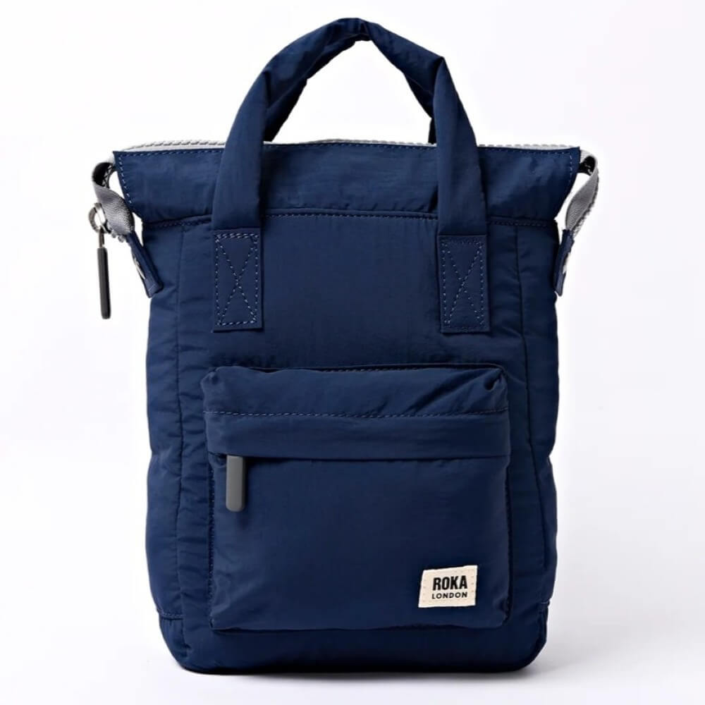 Navy blue backpack with Roka London logo on a white background