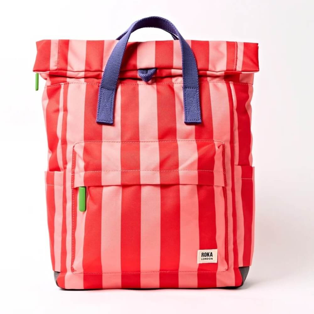 Roka Red and pink striped bag with blue handles on a white background