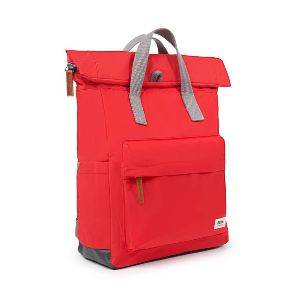 Red backpack with gray straps on a white background