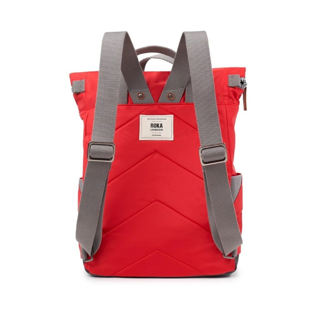 Red backpack with gray straps on a white background