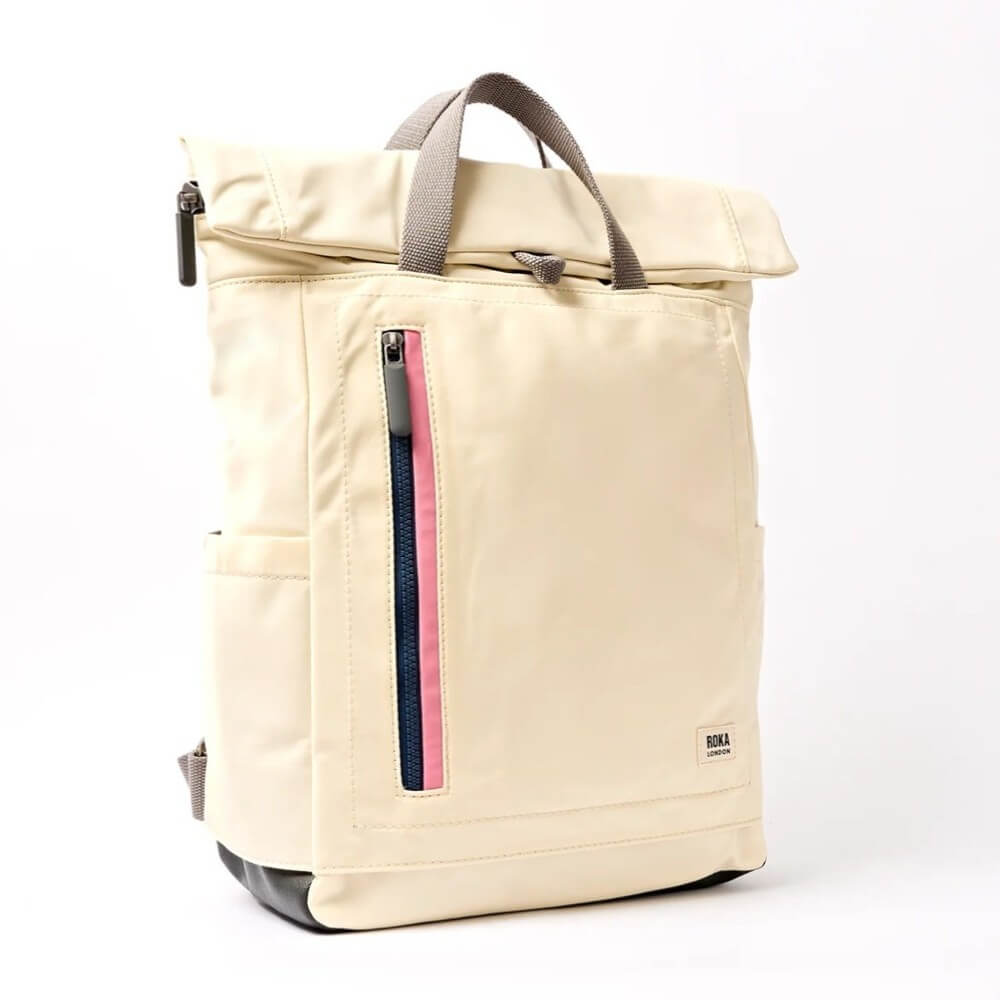 Roka Beige backpack with a pink and blue zipper on a white background