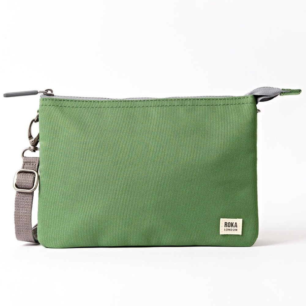 Roka Green crossbody with a grey strap on a white background