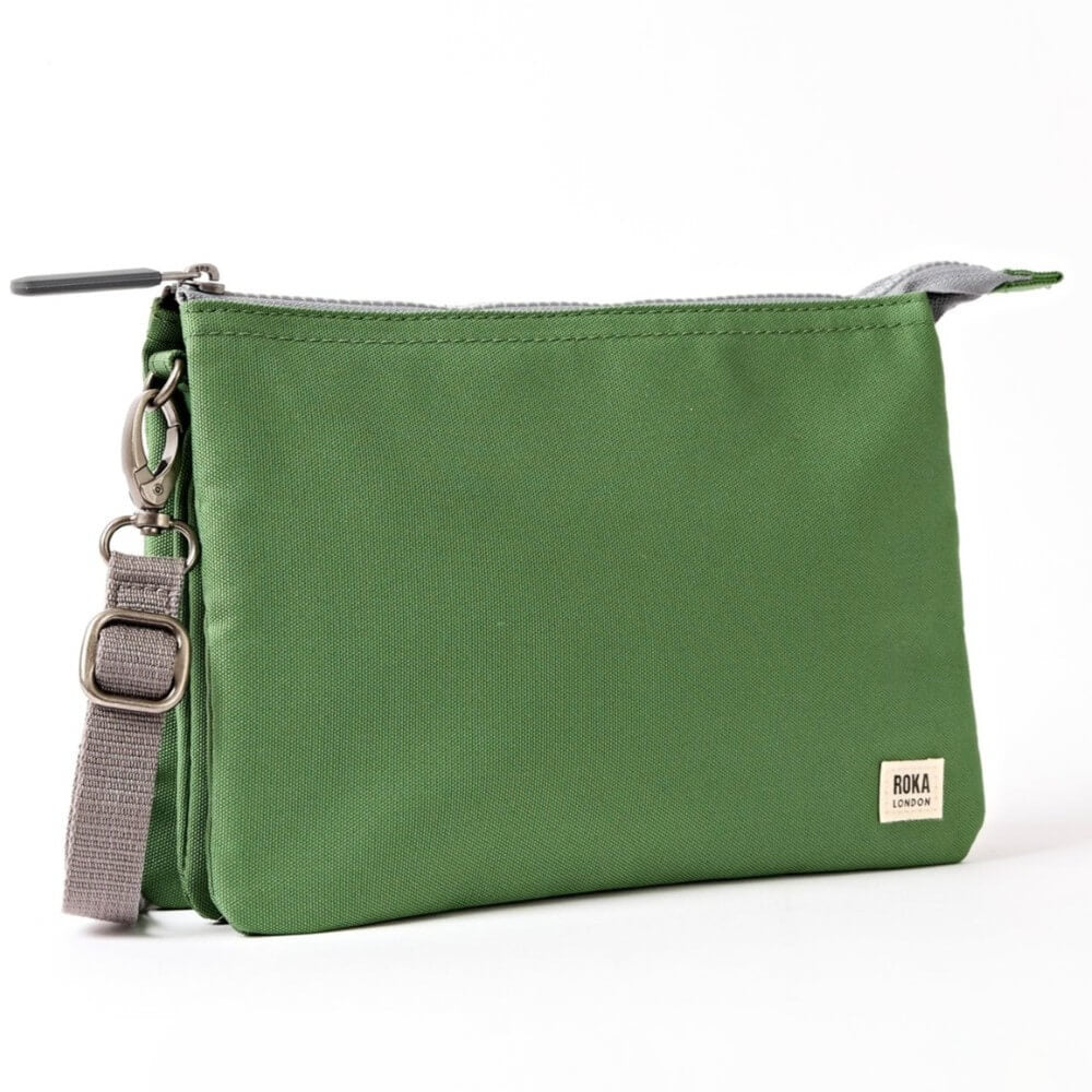 Roka Green crossbody with a grey strap on a white background