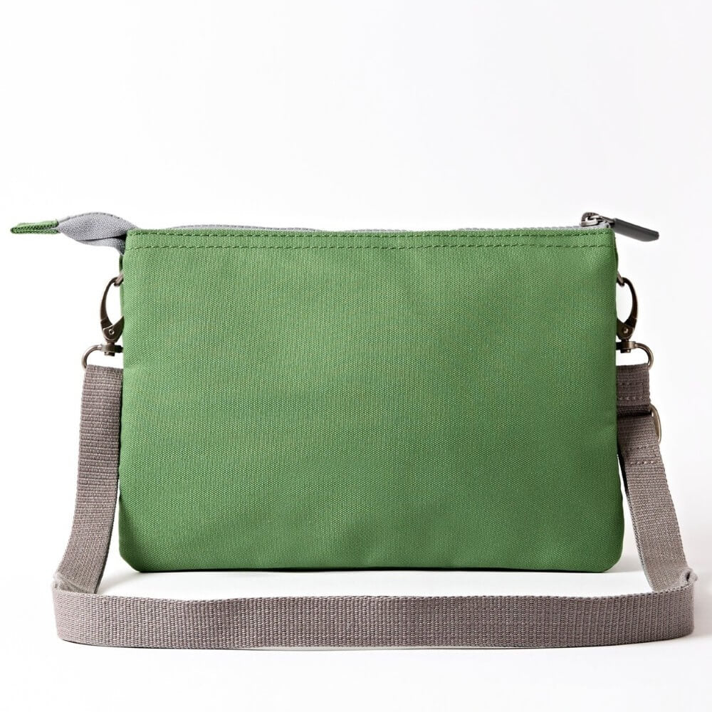 Roka Green crossbody with a grey strap on a white background
