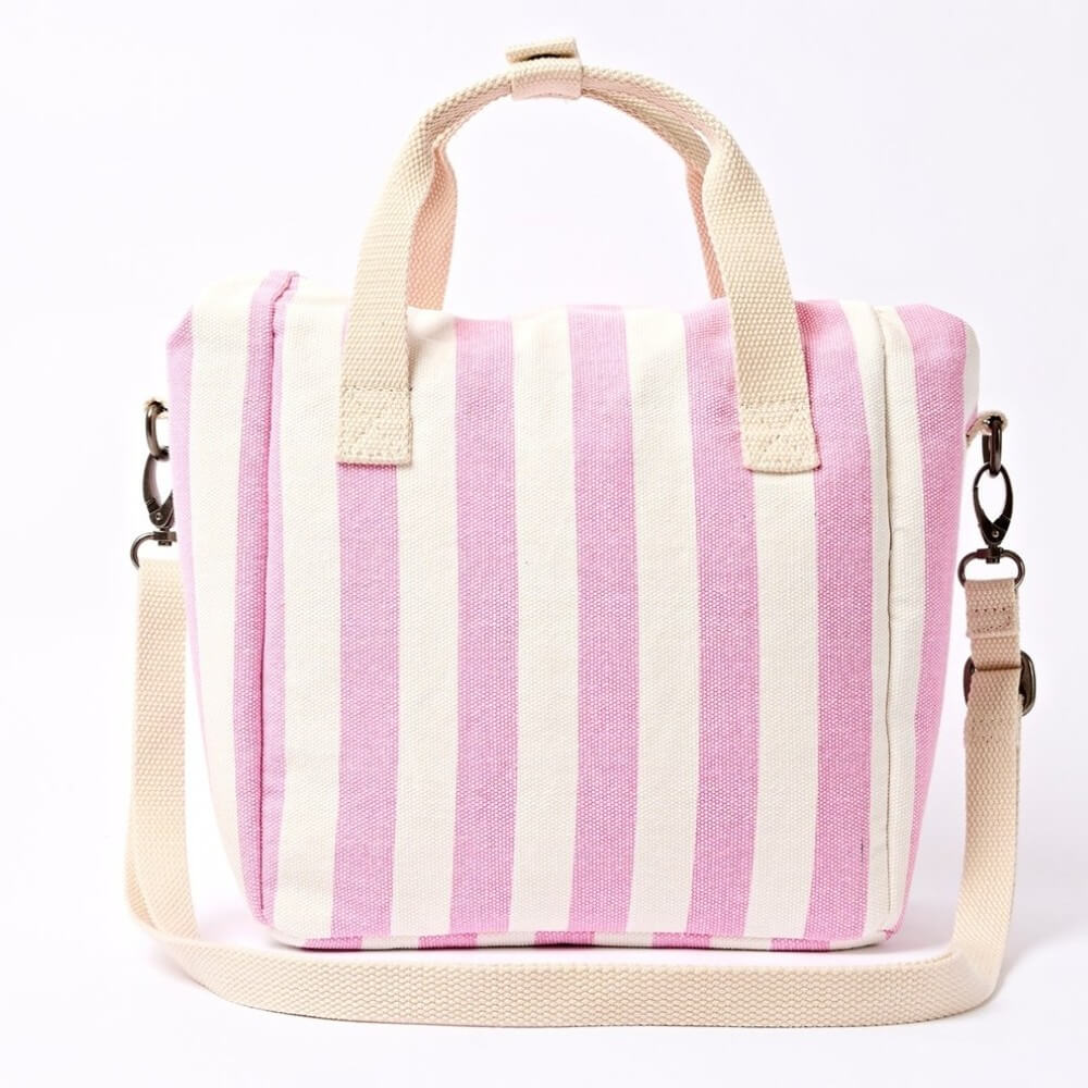 Roka Pink and white striped insulated lunch bag with a shoulder strap on a white background