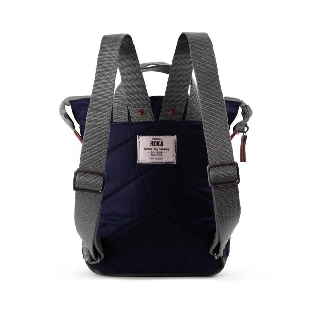 Navy backpack with gray straps on a white background