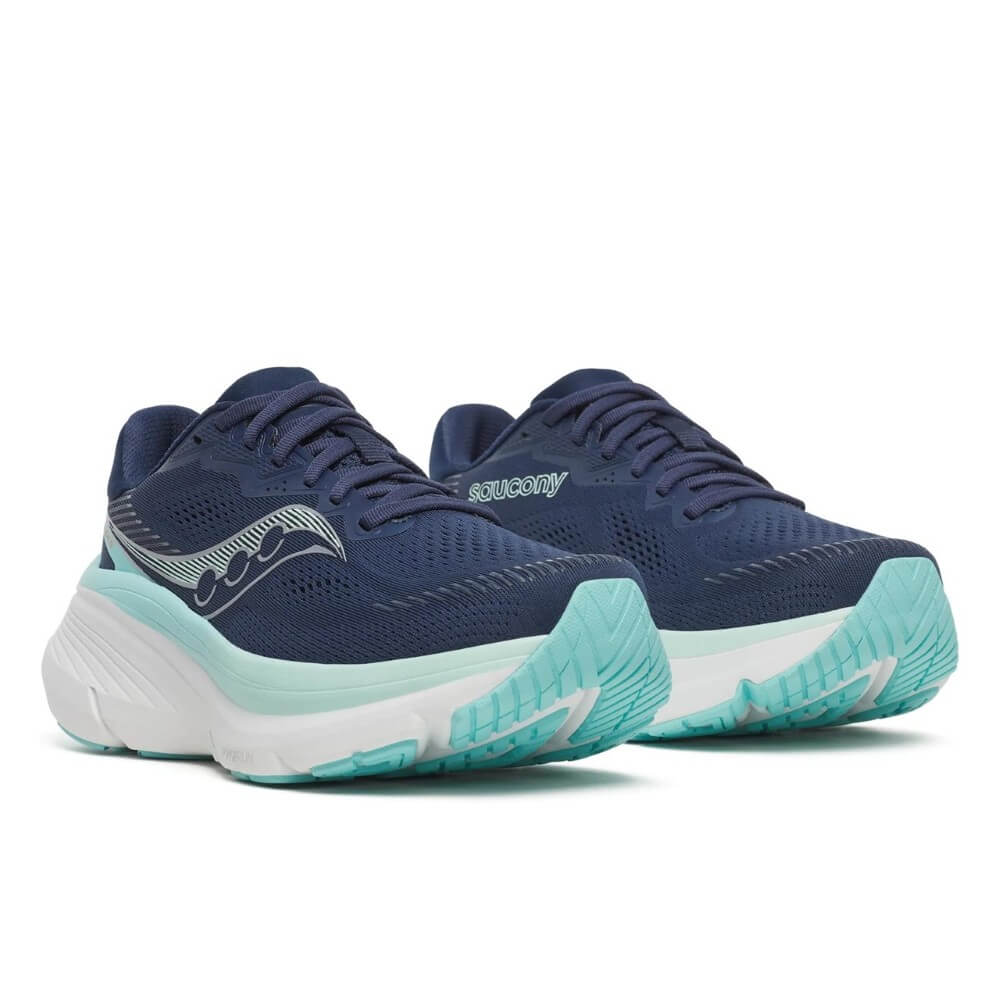 Navy and teal running shoes with 'Saucony' branding on a white background
