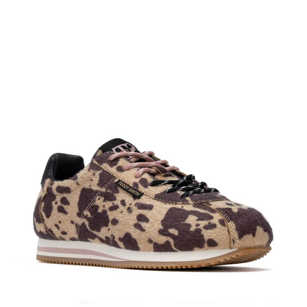 A Teddy Smith low-top sneaker featuring a beige and dark brown animal print pattern, with black laces, a black heel tab, and a white midsole with a light pink stripe.