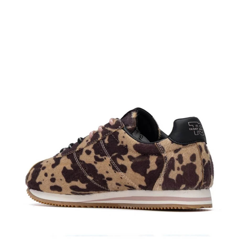 A Teddy Smith low-top sneaker featuring a beige and dark brown animal print pattern, with black laces, a black heel tab, and a white midsole with a light pink stripe.
