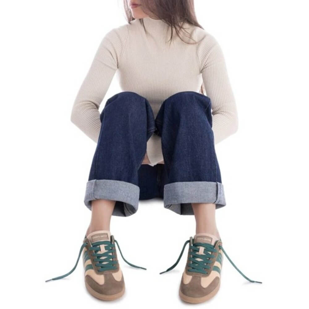 Person wearing blue jeans and green sneakers sitting on a white  background  Teddy Smith Sneakers 120235 Beige