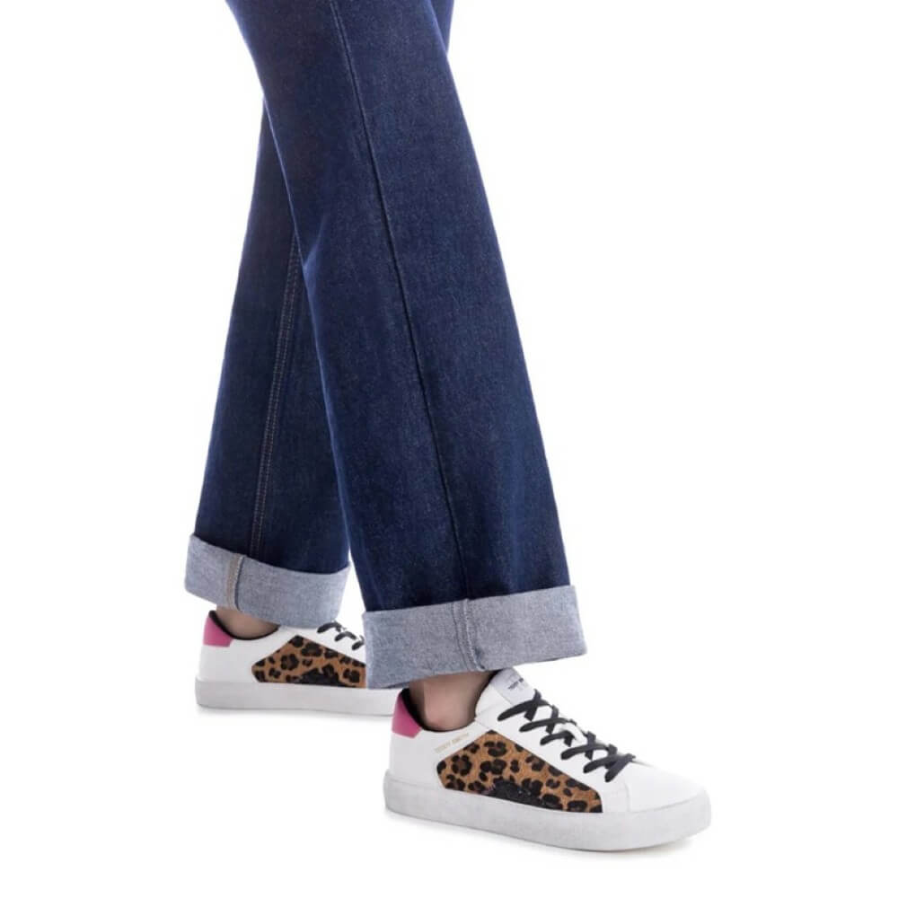 White sneakers with leopard print soles worn with blue jeans on a white background Teddy Smith Trainers 120255 White & Leopard