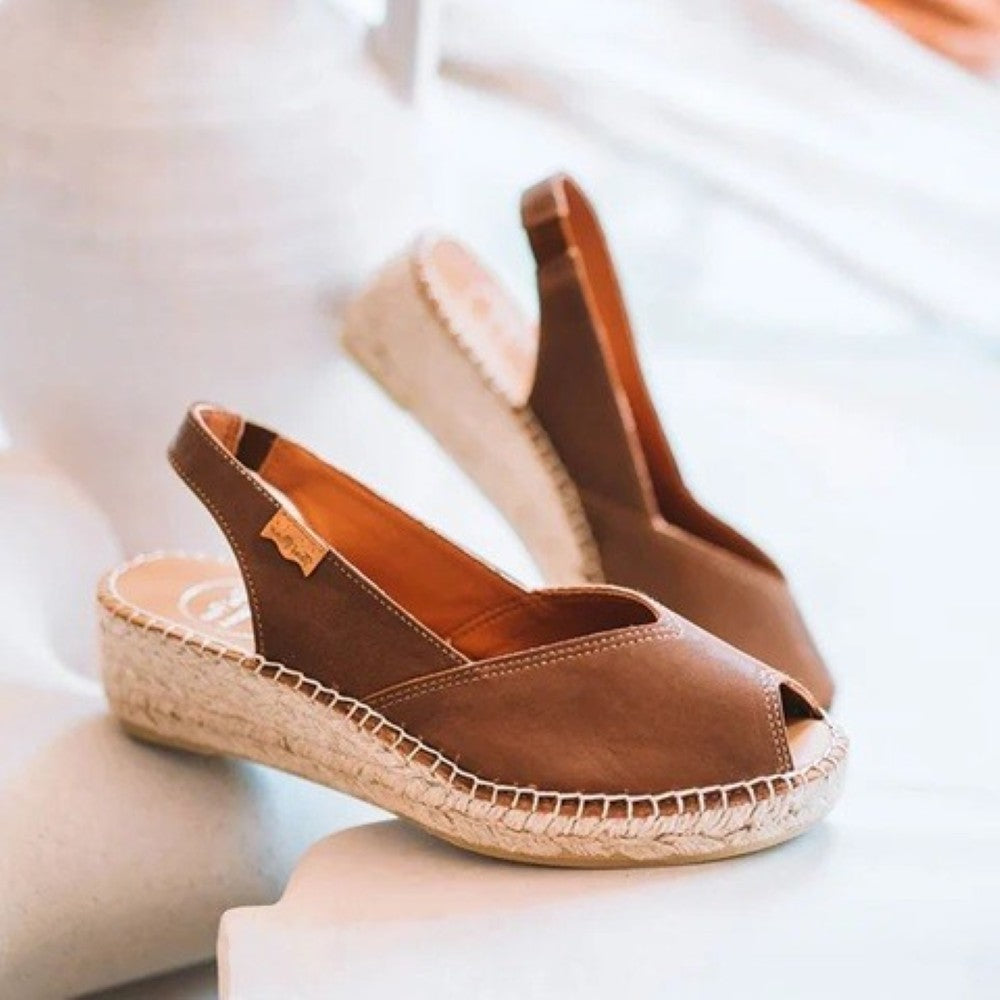 Brown open-toe sandals with espadrille sole on a white background