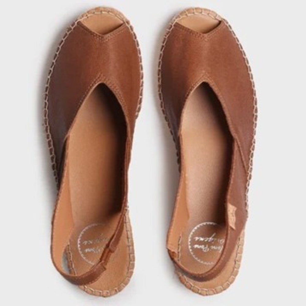 Pair of brown open-toe shoes on a white background