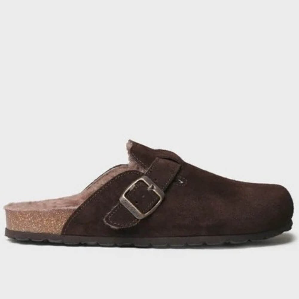 A dark brown clog-style slip-on shoe with a suede upper, adjustable strap, and silver buckle, shown from the side on a light gray background.