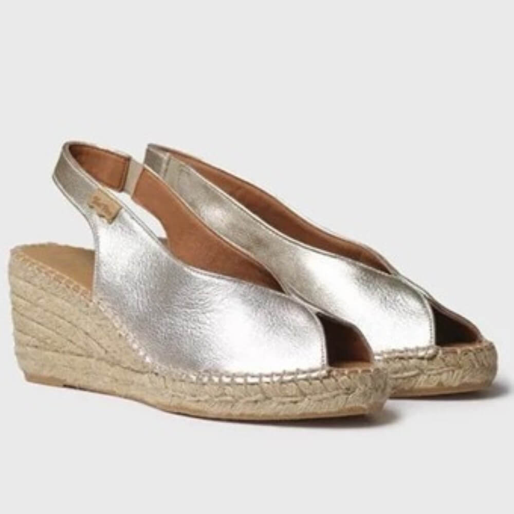 Pair of Toni Pons Gold open-toe shoes on a light grey background