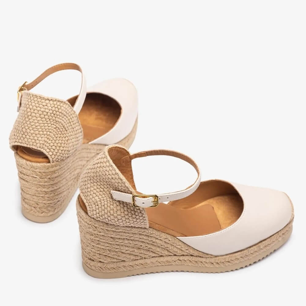 ivory wedge sandals with jute sole on a white background