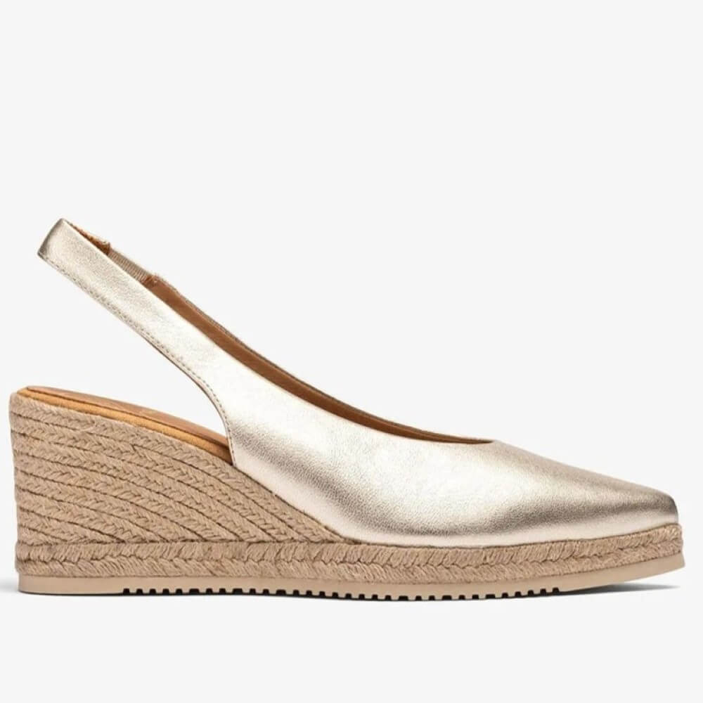 Unisa Gold wedge sandal with espadrille sole on a white background
