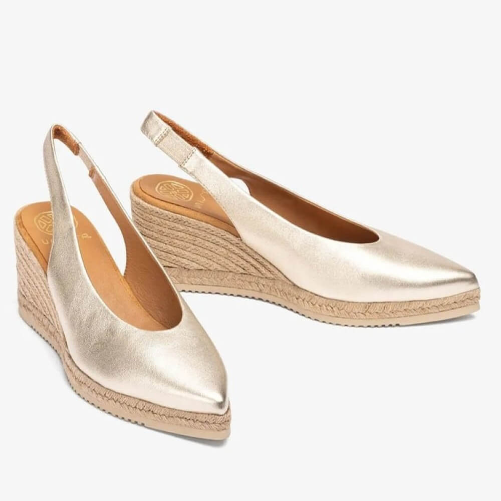 Unisa Gold wedge sandals with espadrille sole on a white background