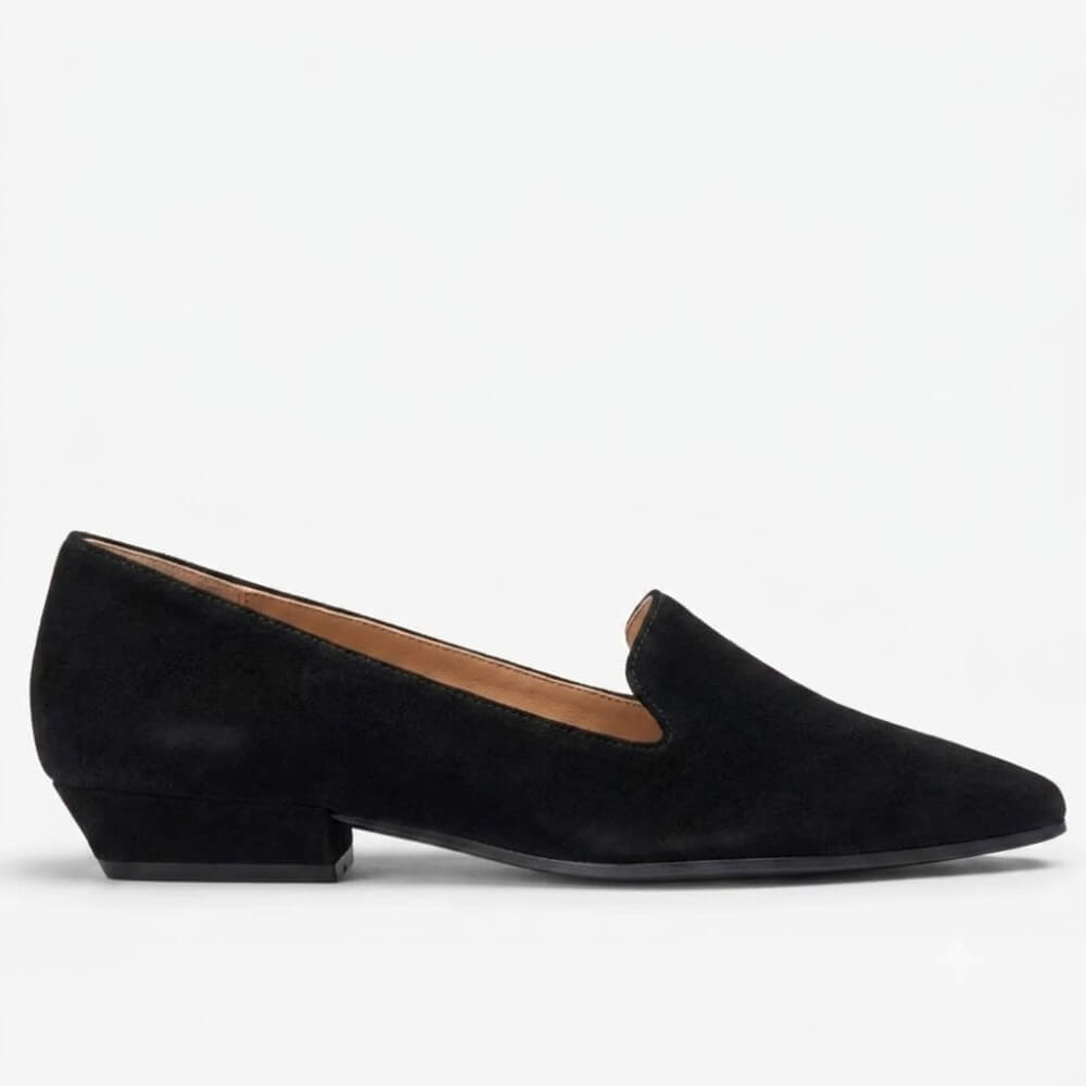 A Unisa black suede loafer with a low block heel and pointed toe, shown in profile against a plain white background.