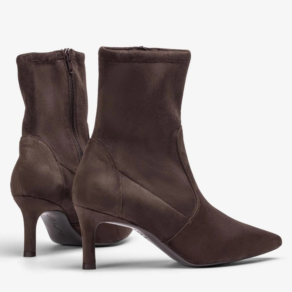 A pair of Unisa dark brown suede ankle boots with pointed toes and kitten heels, shown from the side and back on a light grey background.