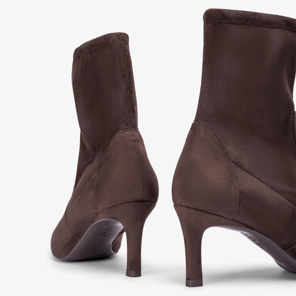 A pair of dark brown ankle boots with kitten heels, shown from the back and side angles against a clean white background.