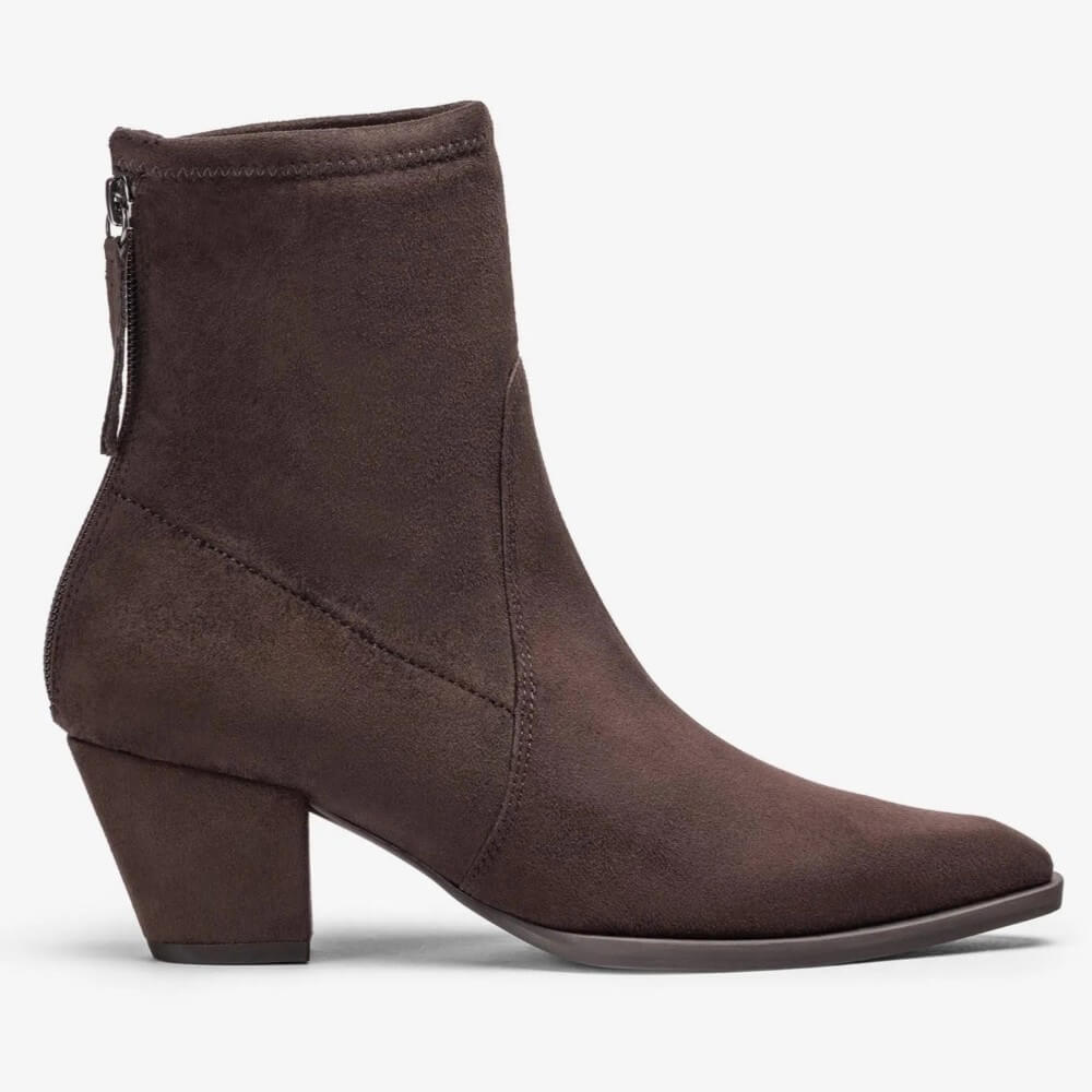 A Unisa dark brown suede ankle boot with a block heel, pointed toe, and a back zipper, shown in profile against a light grey background.