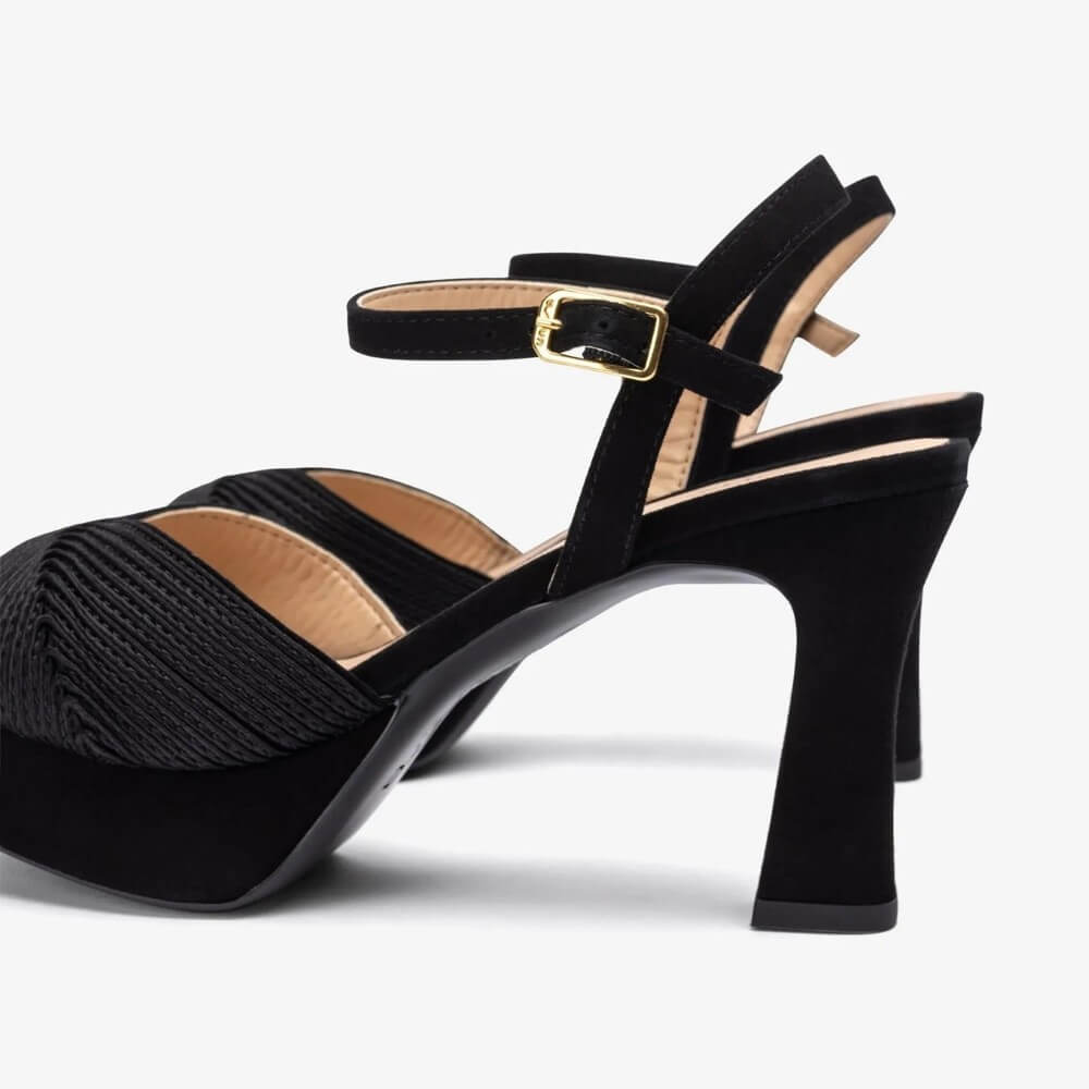 Unisa Black high-heeled sandals with platform sole on a white background