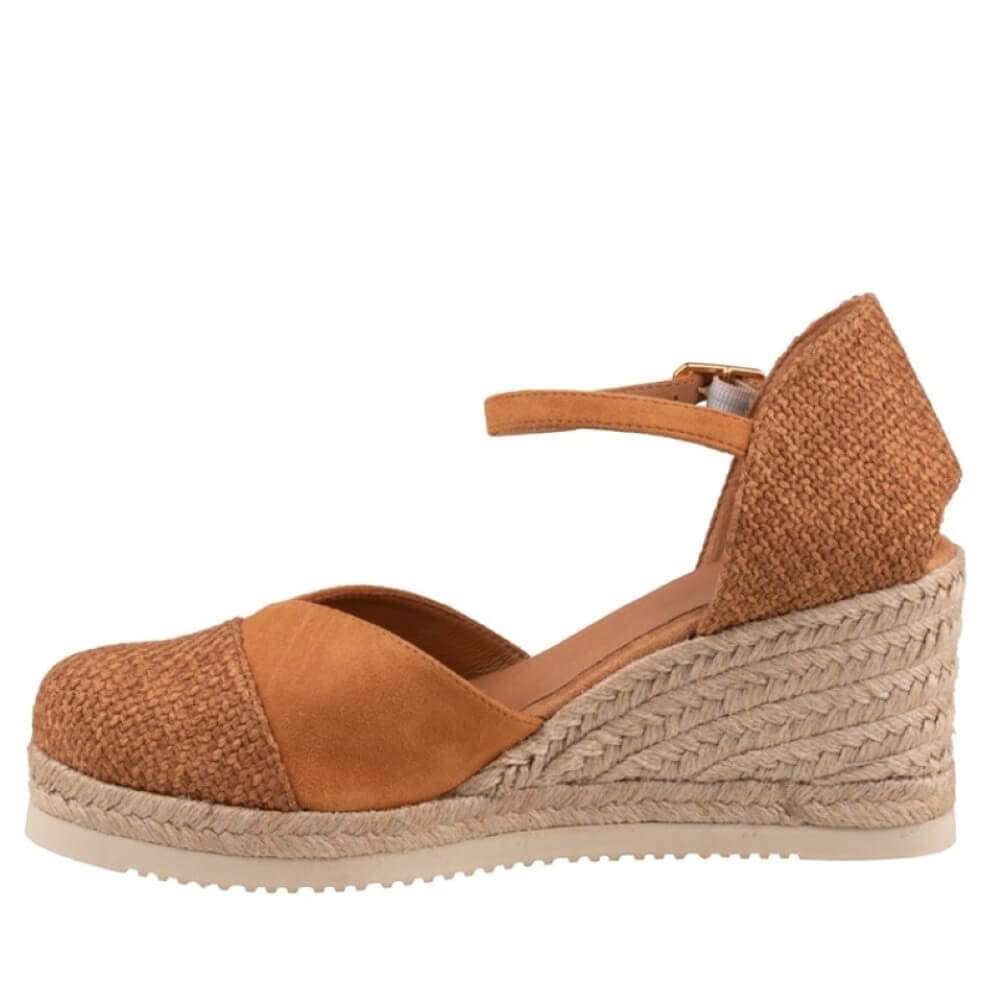 Brown wedge sandal with espadrille sole on a white background