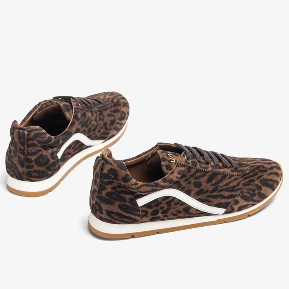 Pair of leopard print sneakers with white soles on a white background Unisa Dalai Suede Trainer Leopard