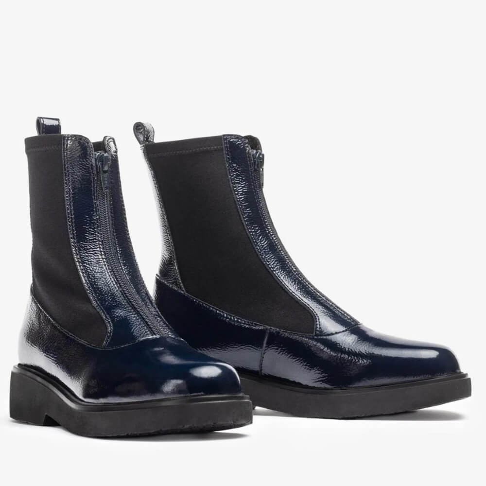 Pair of navy patent leather boots on a white background Unisa Foggia Centre Zip Patent Leather Boot Navy