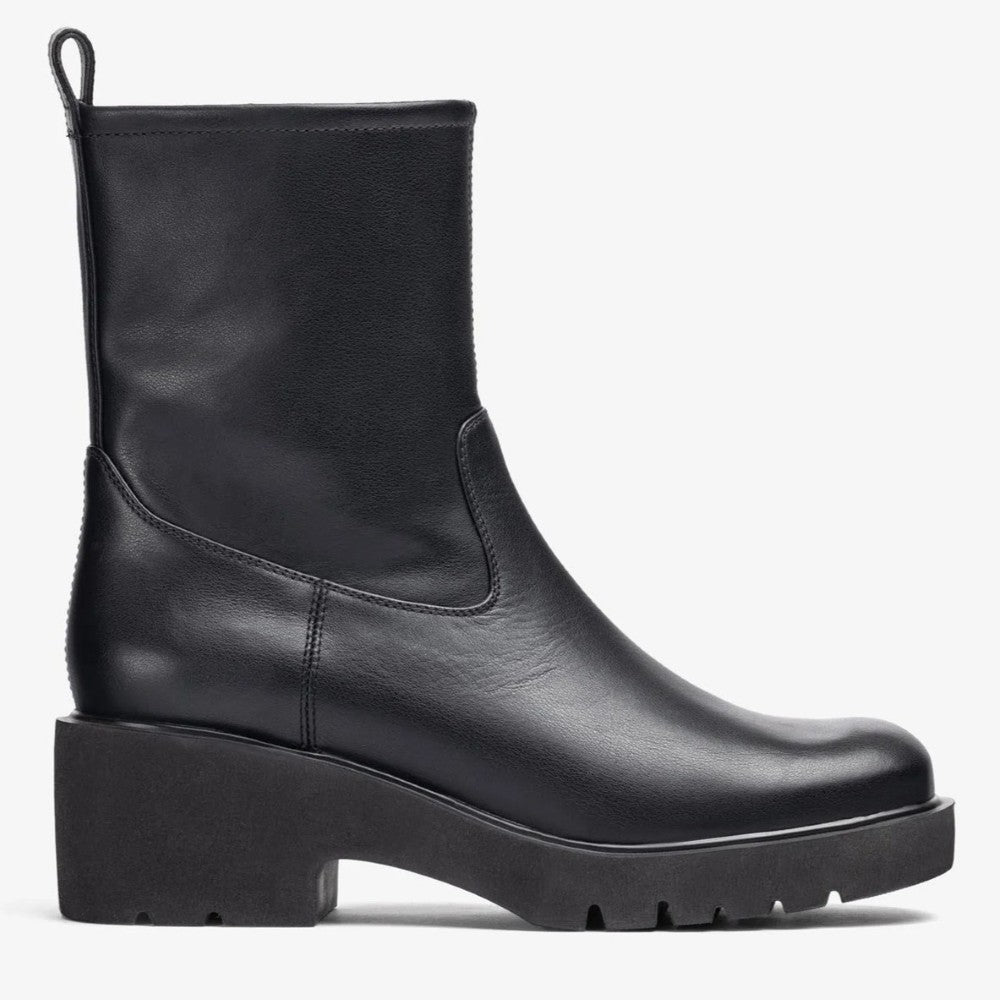 Black leather boot on a white background