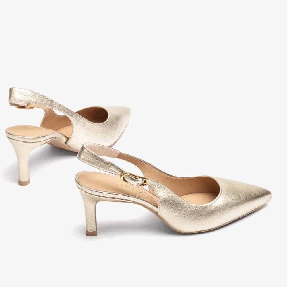 Gold high-heeled shoe on a white background unisa lanz
