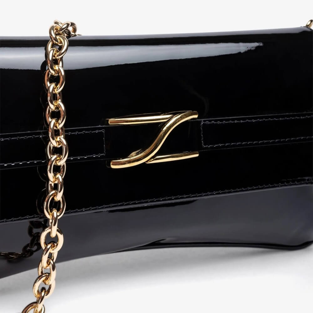 Black handbag with gold chain strap and clasp on a white background Unisa ZBlair Black Patent Shoulder Bag