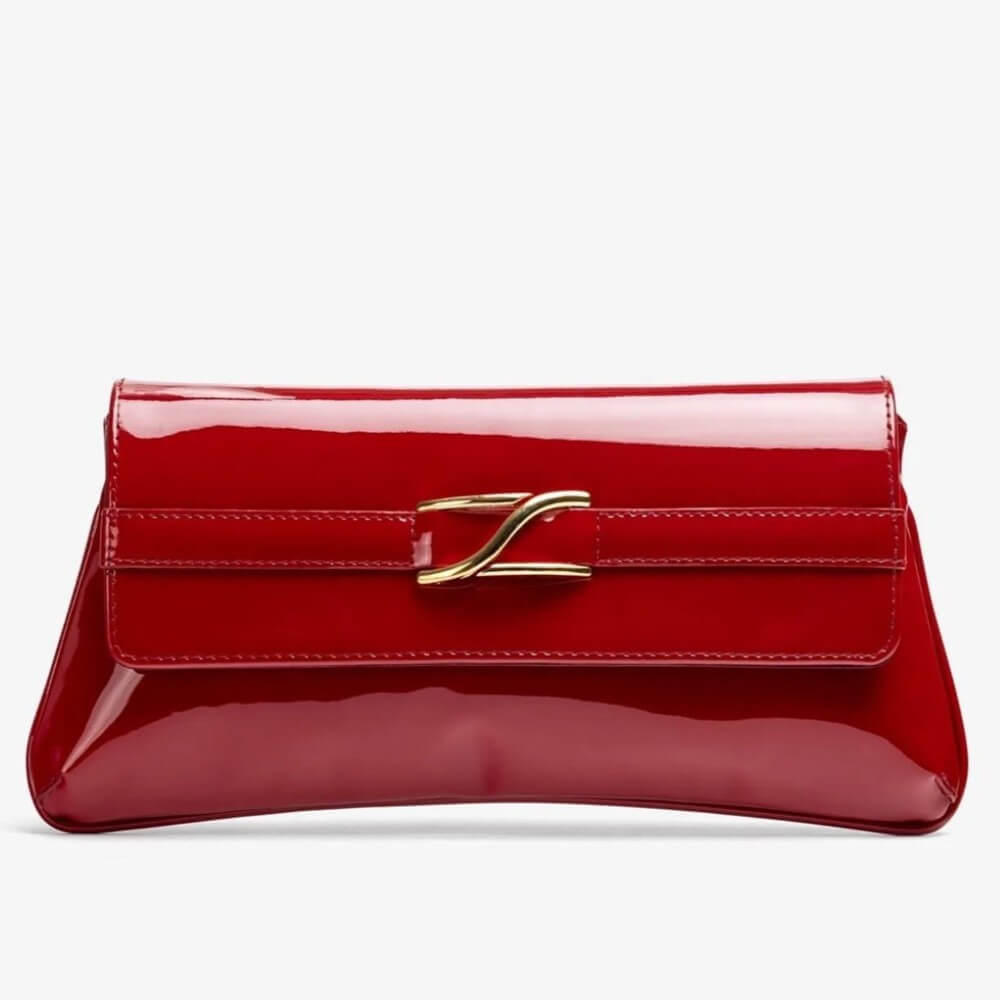 Red patent leather handbag with a gold clasp on a white background Unisa ZBlair Raspberry Red Patent Shoulder Bag
