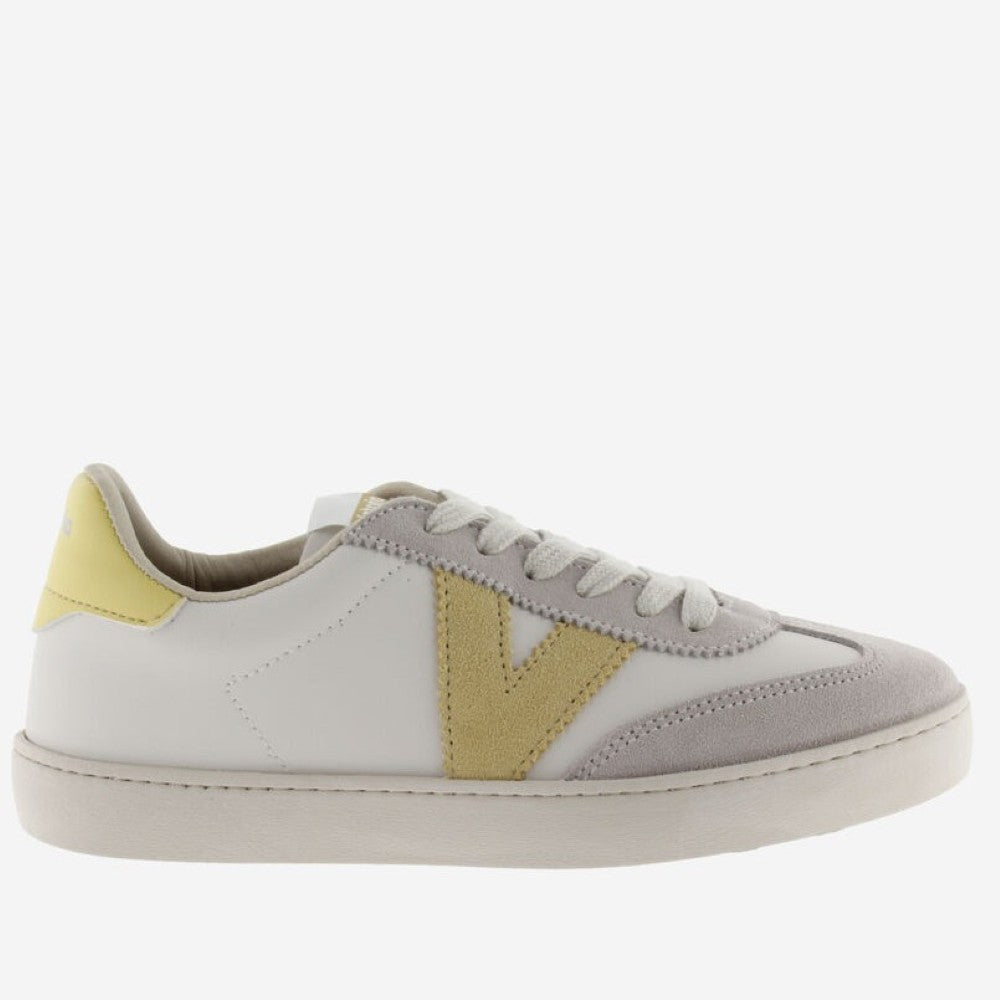  Victoria beige  and white sneaker with yellow accents on a white background