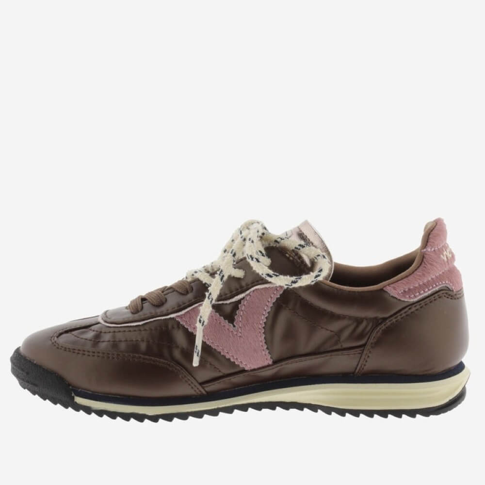 A Victoria brown sneaker with dusty pink accents, cream rope laces, and a black and cream sole, shown from a side profile on a light grey background.