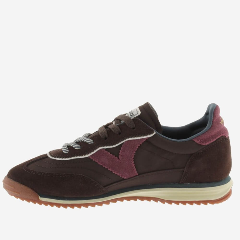 A dark brown suede Victoria sneaker with burgundy overlays, white laces, and a cream midsole on a light grey background.