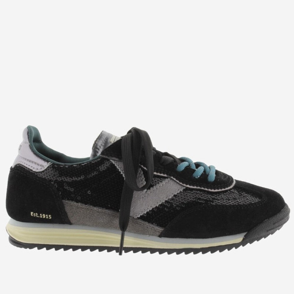 A Victoria low-top sneaker in black and grey suede and sequins , featuring black laces, light blue accents on the eyelets and lining, and a cream-colored midsole.