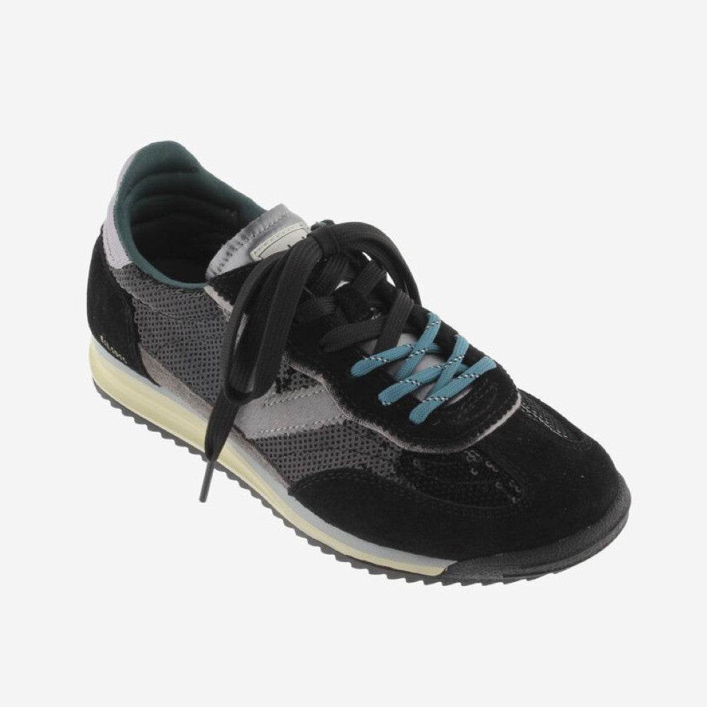 A Victoria low-top sneaker in black and grey suede and sequins , featuring black laces, light blue accents on the eyelets and lining, and a cream-colored midsole.