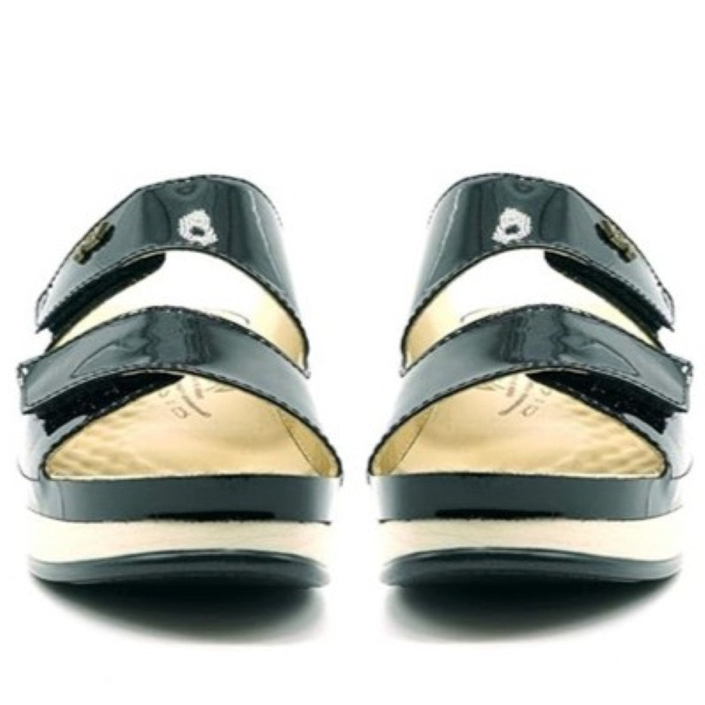 Vital Black patent leather sandals with white soles on a white background