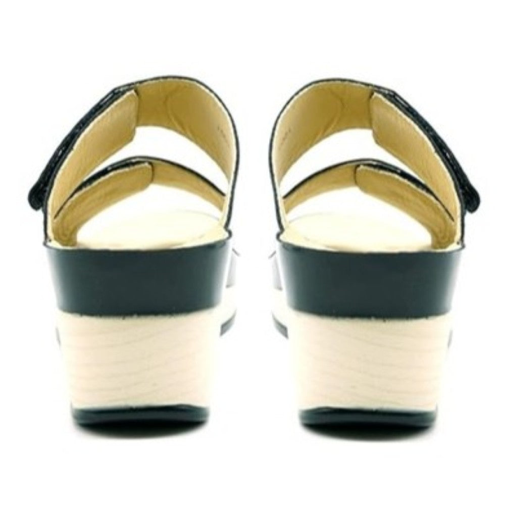 Vital Black patent leather sandal with a white sole on a white background