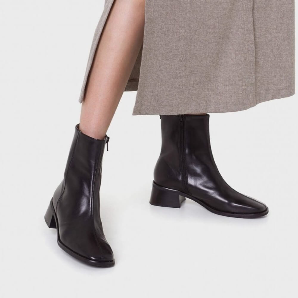 Black leather ankle boot on a light gray background Wonders AYLA 010 ankle boots D-1601 crafted in smooth black leather