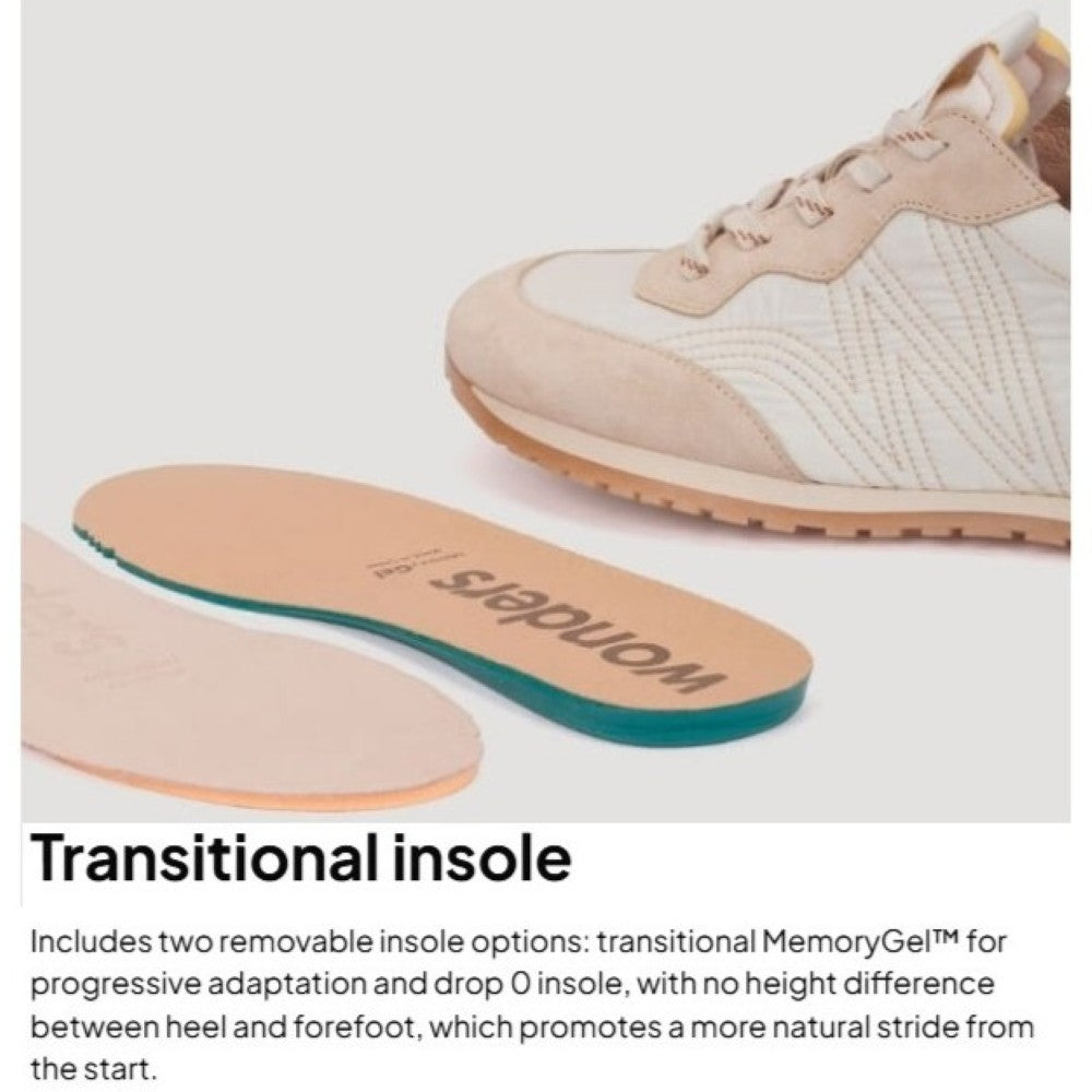 Shoe with a transitional insole on a light gray background